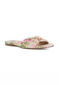 Multicolored slide sandals with textured fabric featuring pink, green, and cream patterns. Flat sole, open toe, and crisscross design.