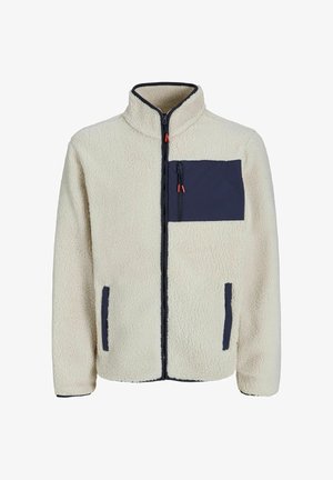 Chaqueta de forro polar en color blanco roto con un bolsillo de pecho con cremallera en navy, bolsillos laterales y un ribete contrastante en navy a lo largo de la cremallera y los puños.