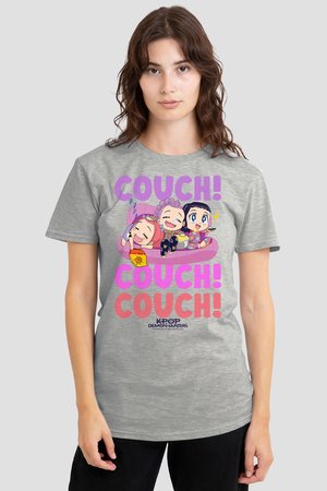 Young woman wears a gray t-shirt with colorful cartoon characters lounging on a couch and the repeated text "COUCH!" in purple and pink.