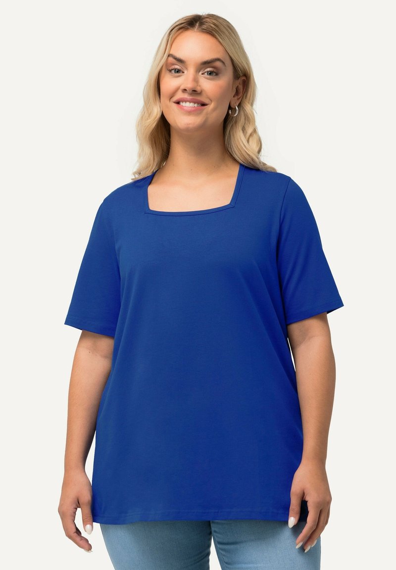 Top de manga corta azul royal con escote cuadrado, que presenta un corte relajado y una tela suave y ligera.