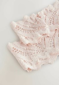 Light pink lace fabric featuring a floral pattern with scalloped edges and a soft, textured finish.