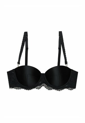 Black lace bra featuring padded cups, adjustable straps, and a scalloped lace trim along the band. Smooth fabric with detailed texture.