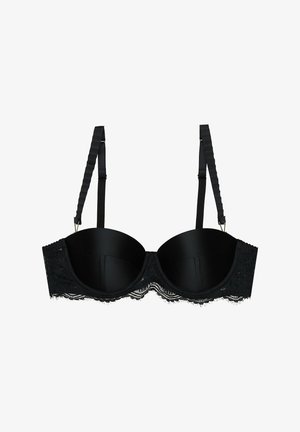 Czarny koronkowy biustonosz z wyściełanymi miseczkami, regulowanymi ramiączkami oraz falbaniastą koronkową listwą wzdłuż boku. Gładki materiał z wyraźną teksturą.