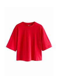 Červené bavlněné tričko s kulatým výstřihem, krátkými rukávy a volným střihem. Má hladkou texturu a minimalistický design bez vzorů.