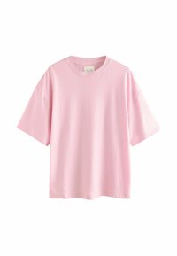 T-shirt en coton rose avec un col rond, des manches courtes et une coupe décontractée. Texture lisse, design simple sans motifs ni accents.