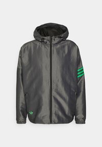 Dark gray hooded jacket with front zipper, green logo on lower left, and three green stripes on the left sleeve.