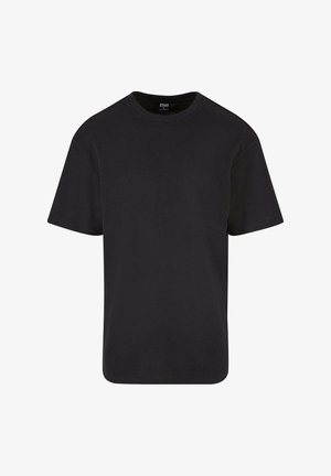 Melna īsām piedurknēm T-kreklu, kas izgatavots no teksturētas auduma, ar apli kaklā un brīvu piegriezumu ar taisnu apakšmalu.