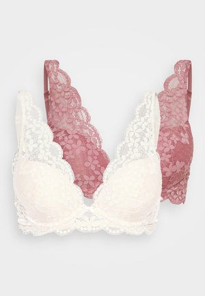 Spitzen-BHs in Elfenbein und Rose mit gewellten Kanten und floralen Mustern. Weicher, strukturierten Stoff mit verstellbaren Trägern und drahtfreiem Design.