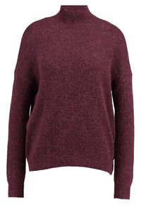 Jersey burdeos de manga larga con cuello alto acanalado. Tejido suave y texturizado con un corte relajado y aberturas laterales en el dobladillo.