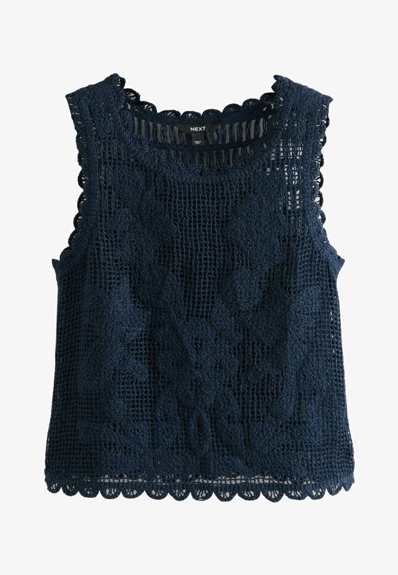 Haut sans manches en crochet bleu marine avec motifs floraux et bords festonnés, étiquette "NEXT" au niveau de l'encolure.