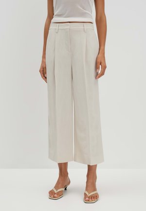 Wide-leg, cream pants with front pleats, high waist, and smooth, lightweight fabric. Accented with a hook and zipper closure.