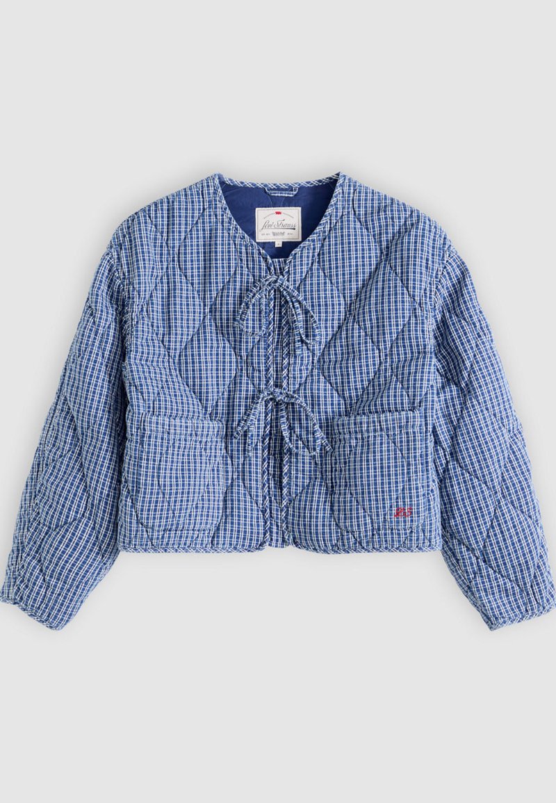 Veste matelassée à carreaux bleu et blanc avec manches longues, fermetures à nouer sur le devant, deux poches avant et un col rond.
