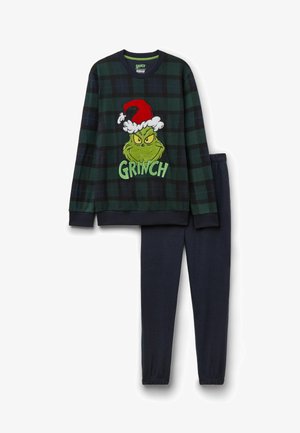 Groene en zwarte geruite pyjama set met een geborduurd Grinch ontwerp met een kerstman hoed. Inclusief een lange mouw top en donkerblauwe elastische broek.