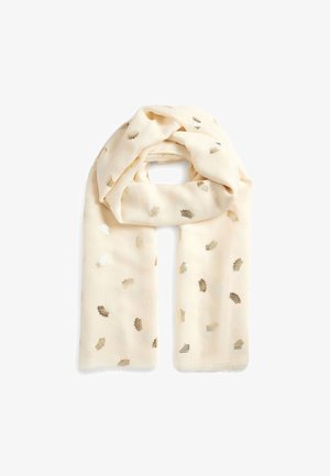 Écharpe crème avec petits motifs de couronnes dorées métalliques, tissu doux, pliée de manière lâche avec des bords frangés sur fond blanc.