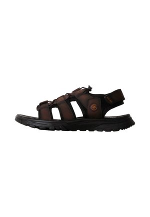 Sandale outdoor en cuir marron pour homme avec lanières ajustables et semelle noire amortissante, conçue pour un usage décontracté et confortable.