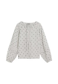 Blusa blanca de manga larga con cuello redondo, que presenta un detalle de lazo y un tejido texturizado, adornada con pequeños patrones florales grises.