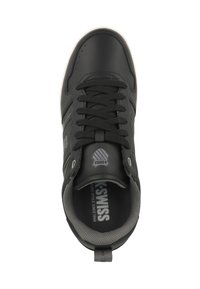 Black athletic shoe with a smooth leather upper, laced design, and gray mesh lining. Features logo on tongue and side accents.