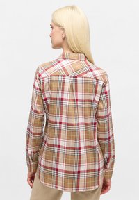 Checkered shirt featuring a brown, red, and white plaid pattern, button-down collar, and long sleeves with button cuffs. Made of fabric with a smooth texture.