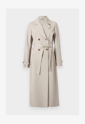 Μακρύ μπεζ διπλόμπουτο παλτό τύπου τρανς με φαρδιές πέτσες, καφέ κουμπιά, ζώνη στη μέση και μανσέτες με κουμπιά.