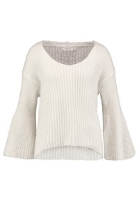 Pull en tricot blanc avec une coupe ample, des manches larges et un décolleté en V profond. La texture est douce et côtelée, créant un motif en maille ajourée.