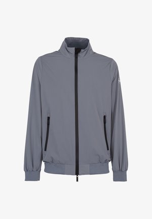 Veste légère grise avec un col montant, une fermeture éclair noire à l'avant, des poches latérales zippées et des poignets et un ourlet élastiques.