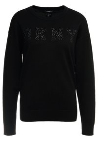 Svart tröja i mjukt material med rund halsringning. "DKNY"-logotyp i strukturerade svarta detaljer på framsidan. Långa ärmar.