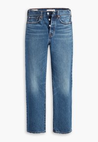 Jean denim bleu à jambes droites avec fermeture à boutons, cinq poches et légère décoloration sur l'avant des cuisses.