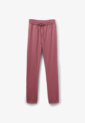 Pantalon en tissu lisse et extensible couleur rose poudré. Il possède une ceinture élastique avec un cordon de serrage et des chevilles fuselées.