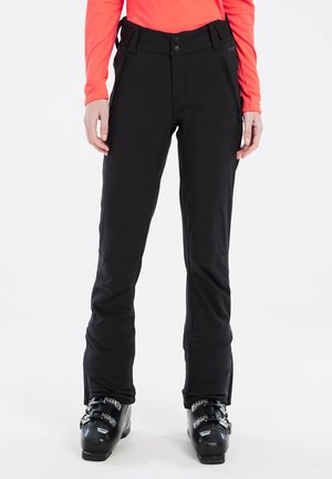 Black ski pants with a smooth, stretchy fabric; feature a high waistband, dual zippered pockets, and adjustable side straps.