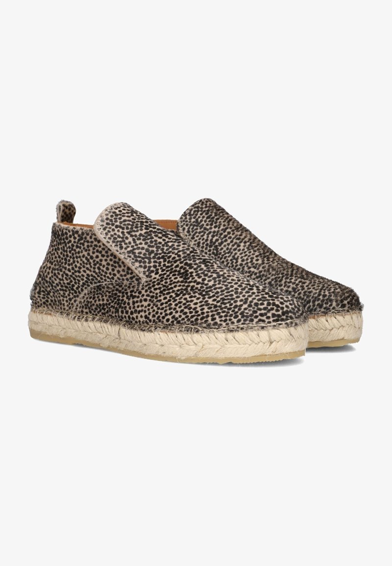 Espadrilles à enfiler avec motif à taches noires et blanches et semelle en jute tressé.