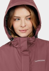 Maroon waterproof jacket with a high collar and adjustable hood. Features include a zipper front and the brand "Didriksons" logo on the chest.