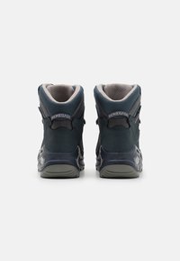 Dark blue hiking boots with a textured upper, padded collar, and contrasting gray accents; designed for durability and support.