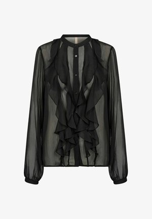 Musta pitkähihaisen paita, joka on valmistettu läpikuultavasta kankaasta. Siinä on nappisuljenta ja kerrokselliset röyhelöt edessä. Rakennekaulus ja hihansuut.