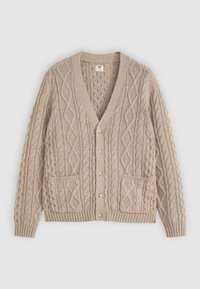 Beige cable knit cardigan with V-neck, button front, two front pockets, and ribbed cuffs and hem on plain background.