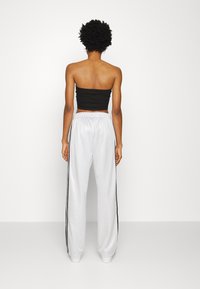 adidas Originals PANTS - Calças de fato de treino - matte silver