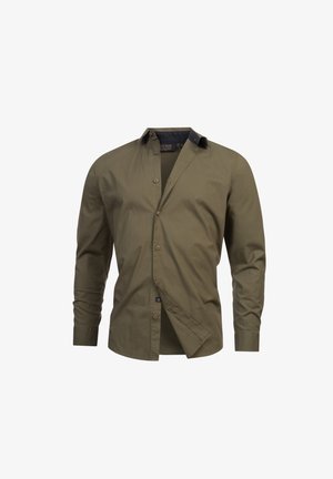 Chemise à manches longues vert olive en coton, avec un devant boutonné, un col contrastant et des accents de bouton. Texture lisse.