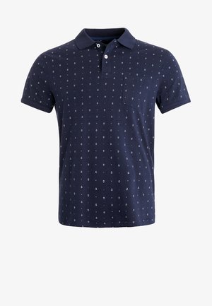 Polo azul marino de algodón, con corte recto, mangas cortas, cuello, un bolsillo y un pequeño estampado de anclas en toda la prenda.