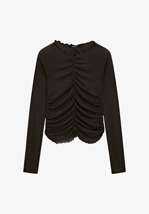 Top nero a maniche lunghe con dettaglio arricciato sul davanti e scollo smerlato. Realizzato in tessuto morbido ed elastico.