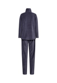 Fleece loungewear set in dark gray, featuring a collar and long sleeves on the top, with matching tapered pants. Soft texture throughout.