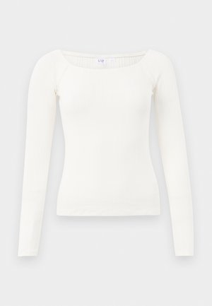 Haut en rib à manches longues blanc avec un décolleté carré, fabriqué en tissu doux. Présente un design ajusté et des ourlets sans coutures pour un look épuré.