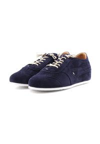 Navy suede sneakers with white rubber soles and beige laces. Features decorative stitching and a smooth texture. Low-top design.