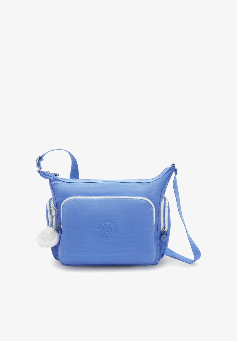 Blå nylon crossbody taske med en tekstureret overflade. Har en forlommer, hvide lynlåsdetaljer og en aftagelig fluffy charms.