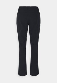 Czarne, rozszerzane spodnie wykonane z gładkiej tkaniny z elastycznym pasem. Posiadają tylny karczek, brak widocznych elementów metalowych i kieszeni.