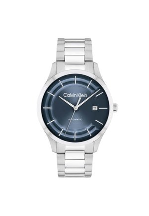 Calvin Klein men's silver metal bracelet watch with dark blue dial, silver hour markers, date window at 3 o'clock, and three hands showing 10:10:39.