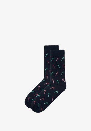 Navy socks featuring a pattern of red and green candy canes. Made of smooth fabric with a classic crew height and ribbed cuff.