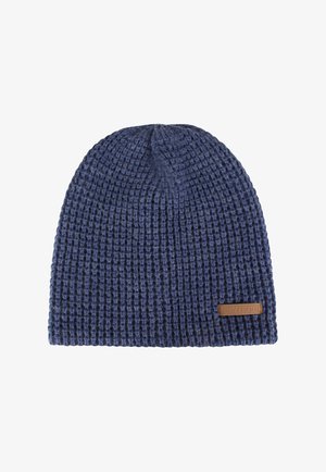 Dark blue knitted beanie with a waffle texture and a small brown rectangular label on the bottom right side.