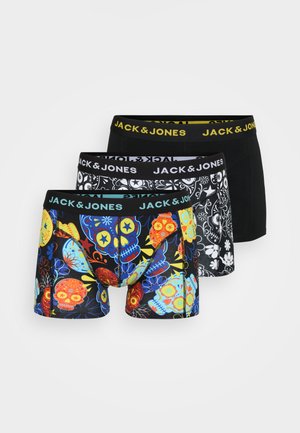 Three pairs of boxer shorts: one with colorful skull designs, one in black with a floral pattern, and a plain black pair. All feature elastic waistbands.