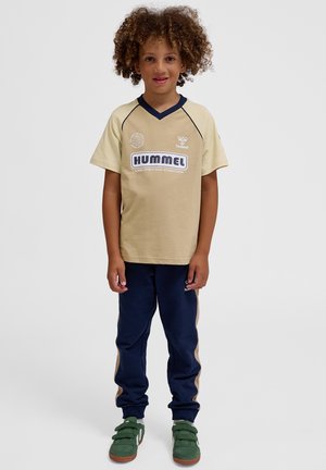 Hummel HMLROLF UNISEX beżowy