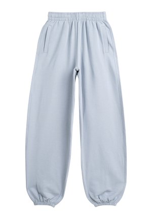 Jasnoniebieskie dresy z elastycznym pasem, bocznymi kieszeniami i elastycznymi mankietami, pokazane na płasko na białym tle.