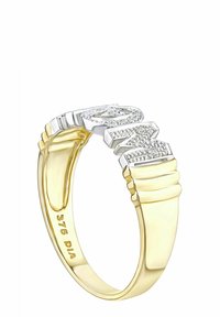 Prsteň zo zlata a striebra s textúrovaným pásom. Vrch zdobený diamantmi a vnútorné rytiny. Výrazný dvojfarebný dizajn.